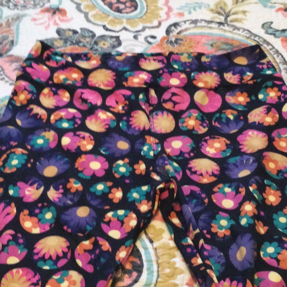 Brand new Lularoe Leggings, Size TC. Black with Floral pattern in purple, pink